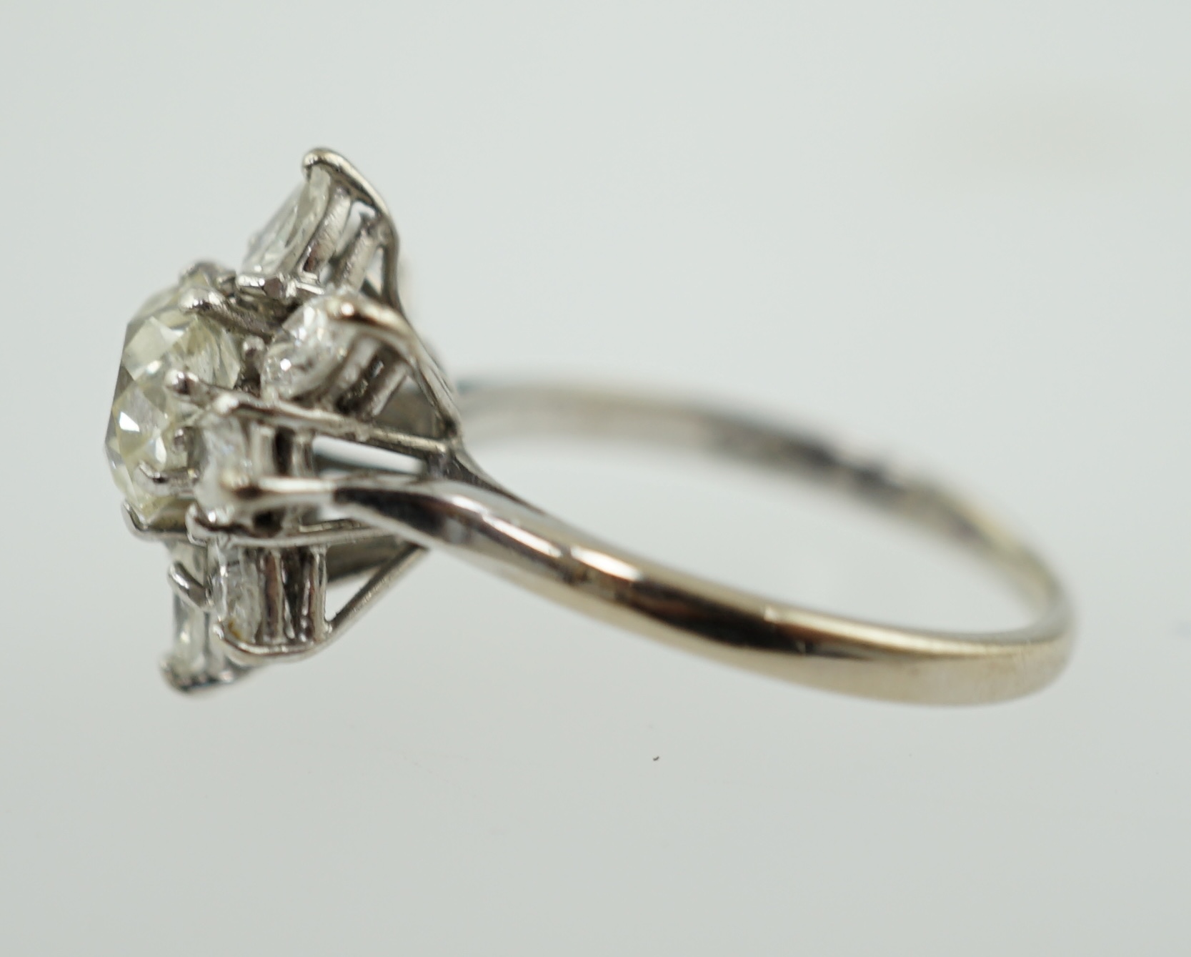 A modern 18ct white gold and diamond flower head cluster ring